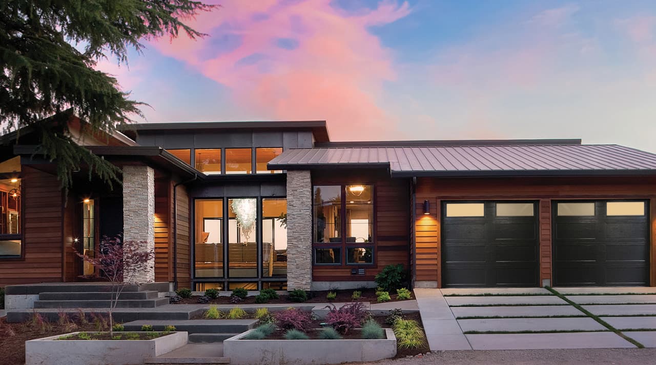 Modern home with overhead garage doors